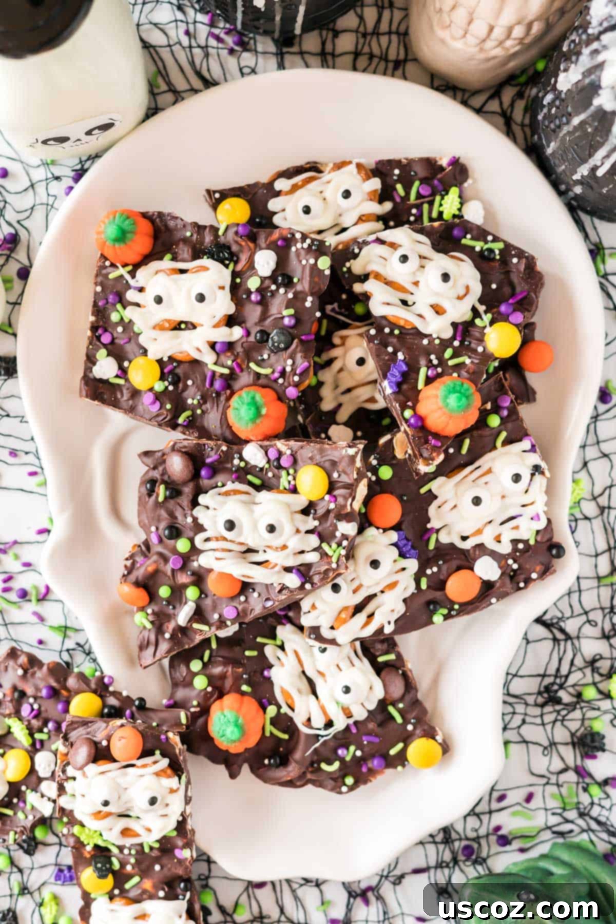 Monster Mash Bark 17 halloween bark displayed on a skull serving dish with a black background