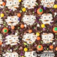Monster Mash Bark 19 halloween bark with pretzel mummies and other candy toppings