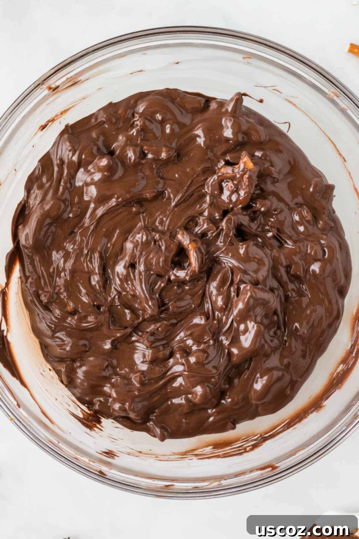 Monster Mash Bark 6 melted chocolate and pretzels mixed together in a bowl