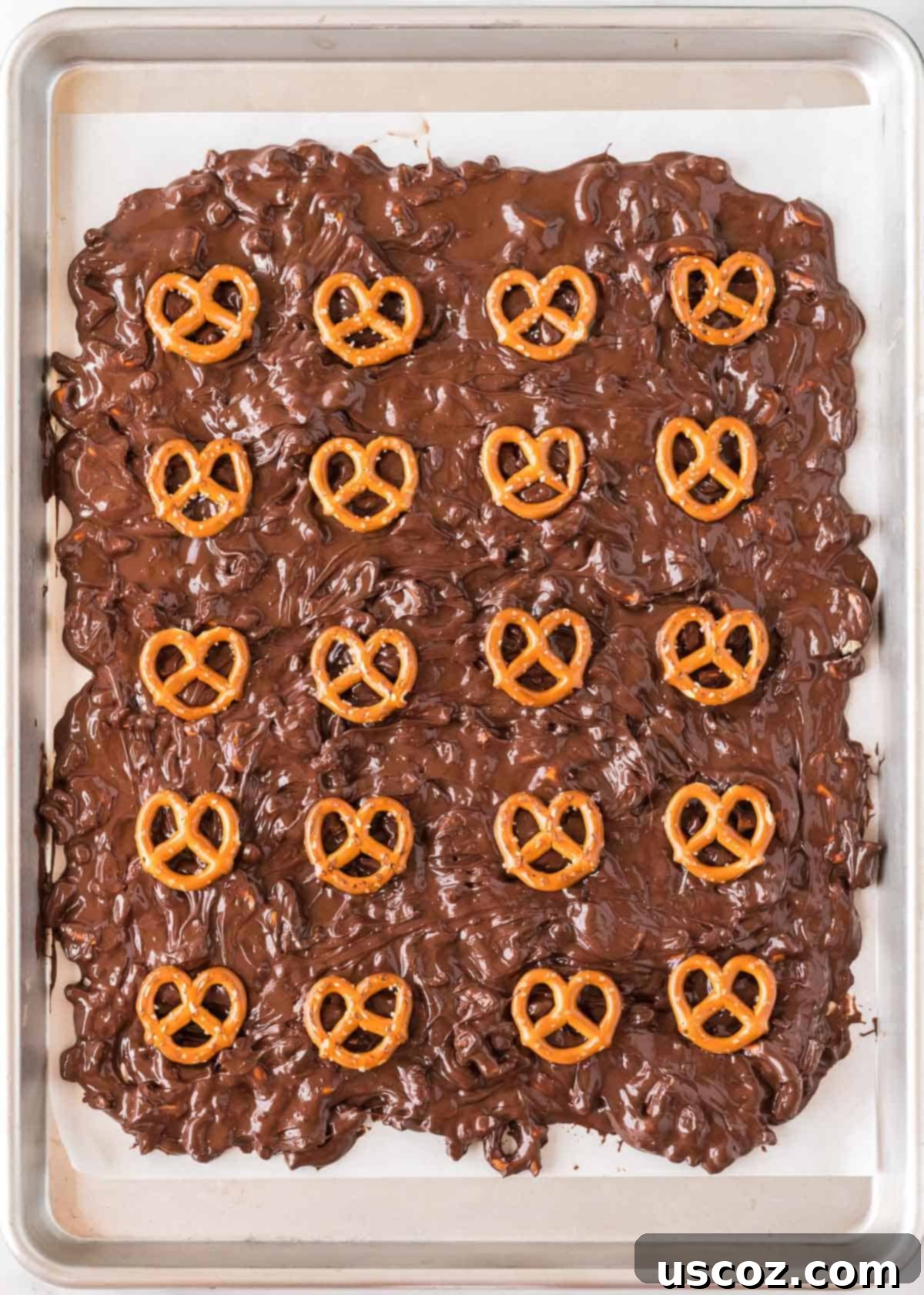 Monster Mash Bark 8 topping the bark with whole mini pretzels for the mummies