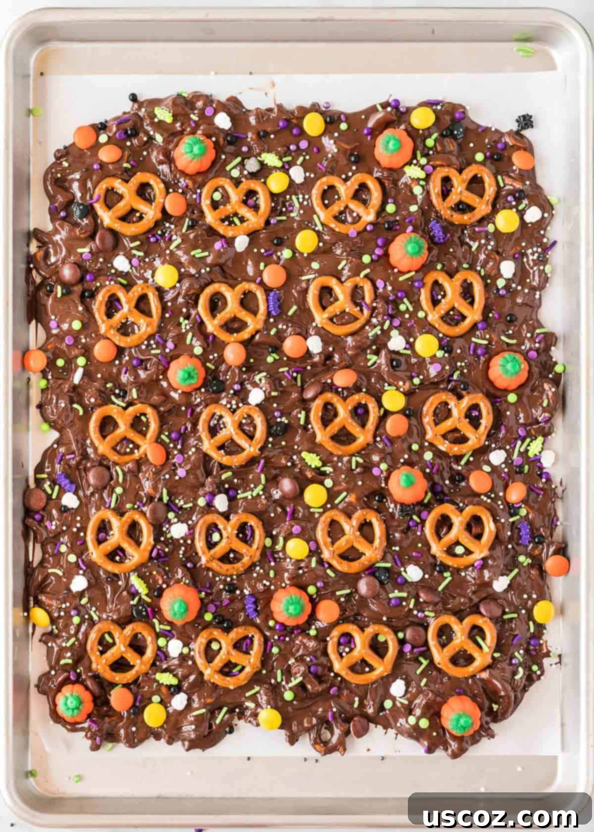 Monster Mash Bark 9 decorating the halloween bark with a variety of candies and sprinkles