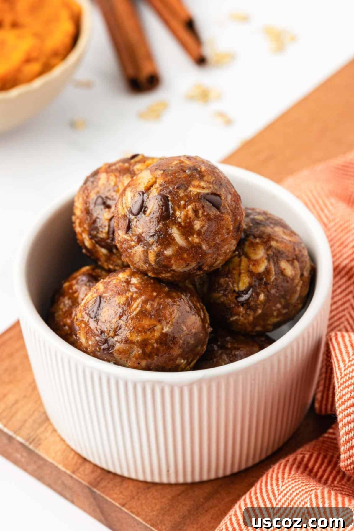 Pumpkin Protein Bites 3 Close-up of golden pumpkin protein balls, perfectly round and inviting