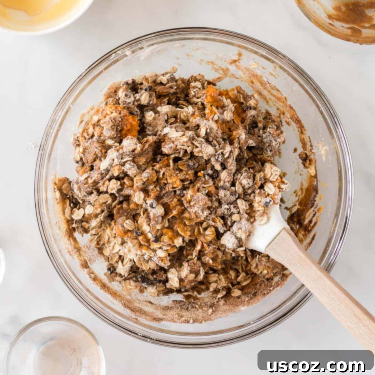 Pumpkin Protein Bites 6 Mixing together the energy ball dough in a glass bowl