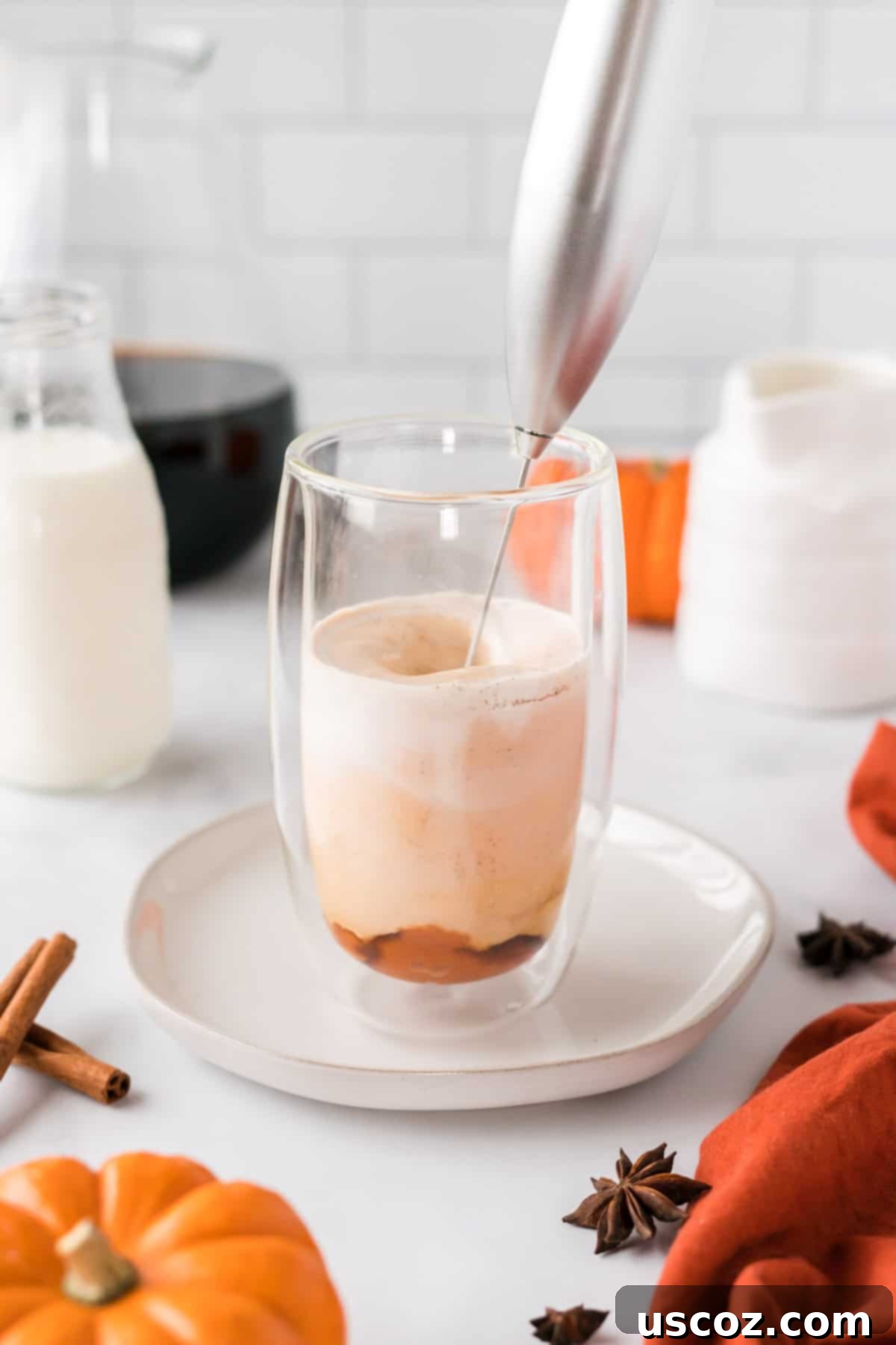 Spiced Pumpkin Cold Brew 5 Handheld milk frother mixing the pumpkin cream ingredients in a glass