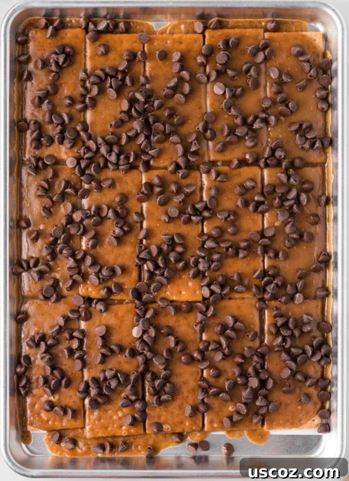 Golden Graham Toffee 11 sprinkling semi-sweet chocolate chips over the hot graham cracker toffee