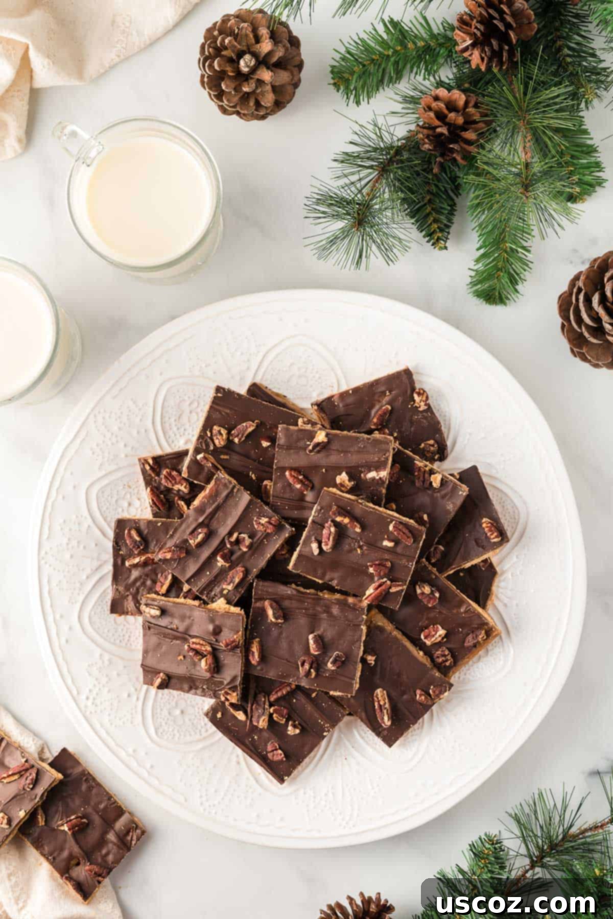 Golden Graham Toffee 15 several pieces of graham cracker toffee stacked on a white plate