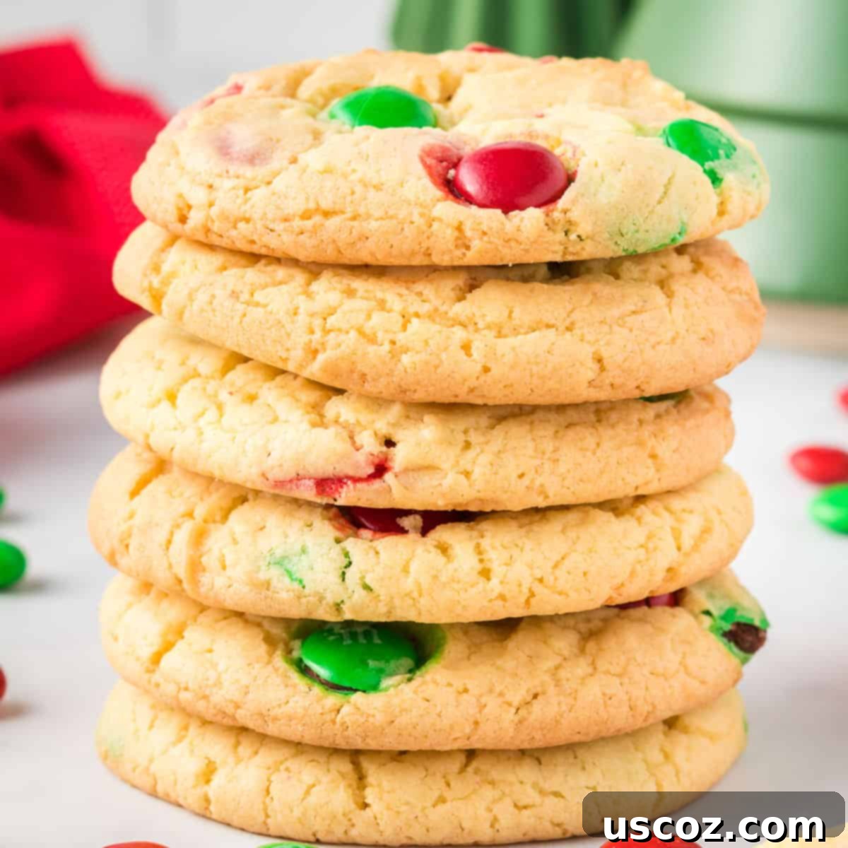 Effortless Holiday Cake Mix Cookies 2 Stacked up vibrant Christmas cookies with red and green M&M's, ready for the holidays
