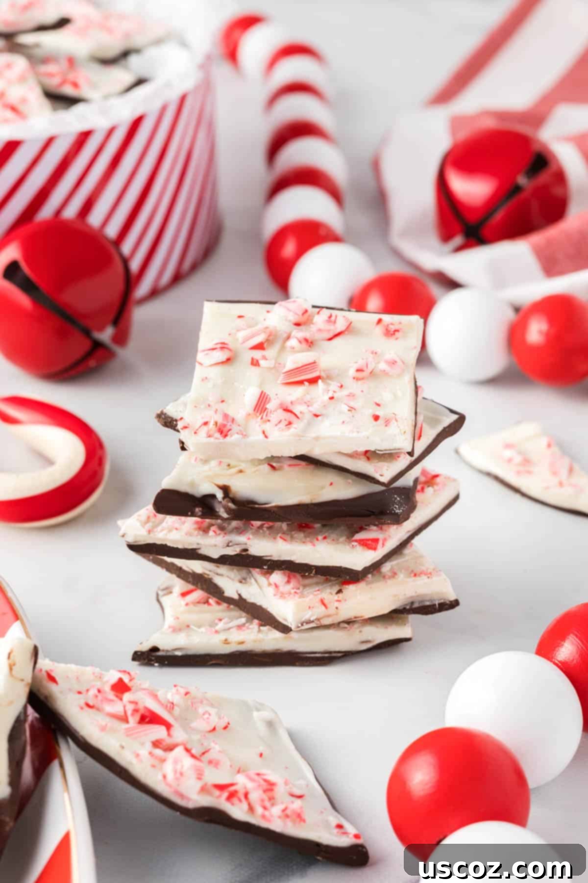 Decadent Mint Chocolate Bark 17 Several pieces of rich chocolate peppermint bark stacked elegantly, ready to be enjoyed or shared during the holiday season.