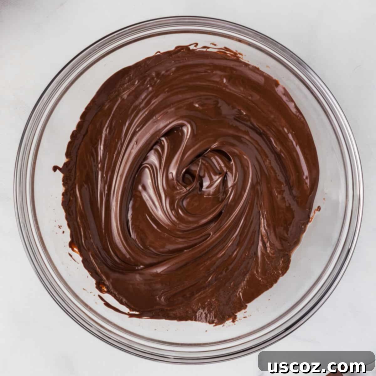 Decadent Mint Chocolate Bark 6 Smooth, melted dark chocolate in a bowl, infused with peppermint extract, ready for the first layer of bark.