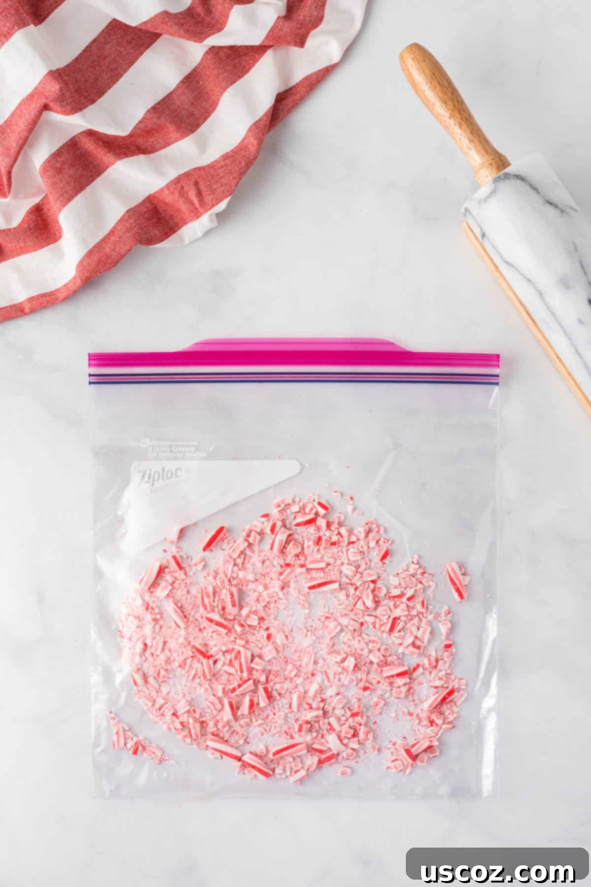 Decadent Mint Chocolate Bark 9 Crushed candy canes inside a ziploc bag, showing a mix of fine powder and small pieces, perfect for decorating.