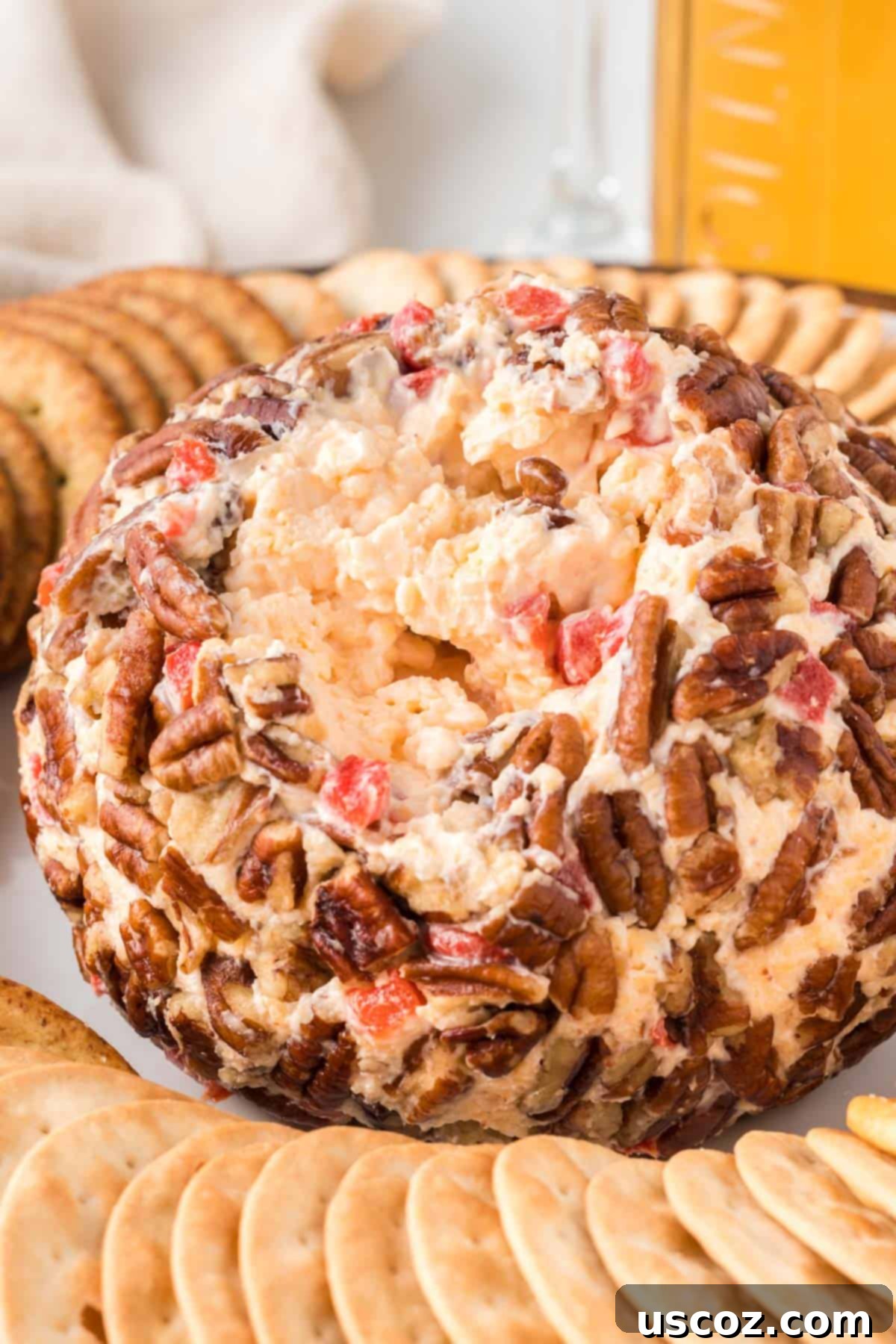 Classic Pimento Cheese Ball 14 pimento cheese ball with a serving taken out