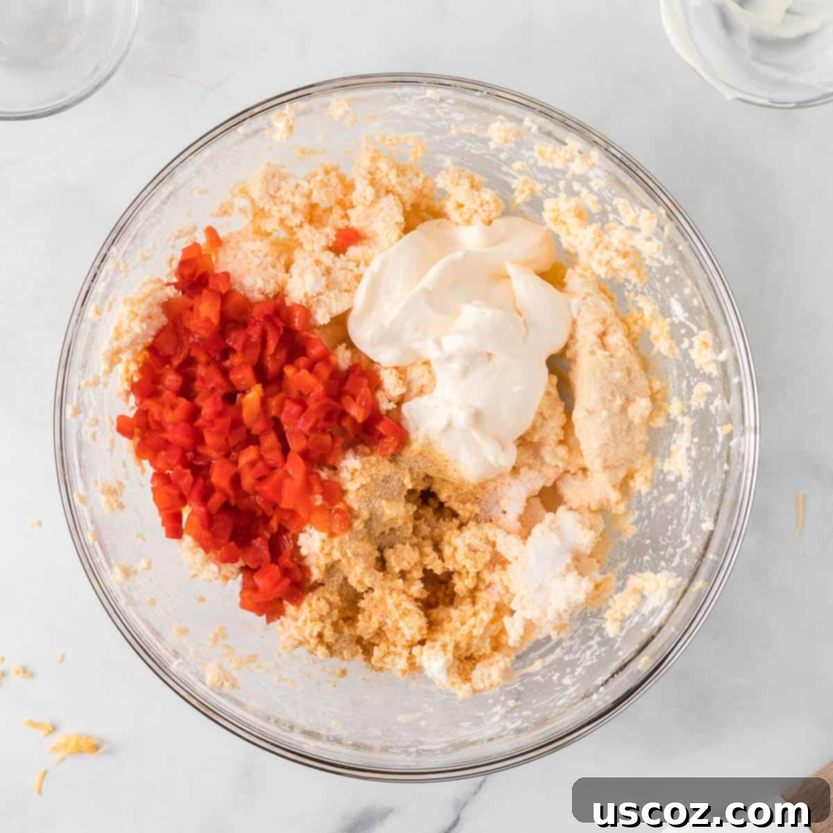 Classic Pimento Cheese Ball 8 pimentos, mayo, and spices added to the bowl