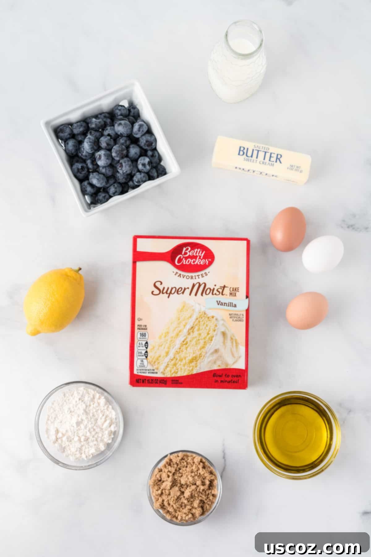Effortless Cake Mix Blueberry Muffins 3 A selection of ingredients laid out for making cake mix blueberry muffins