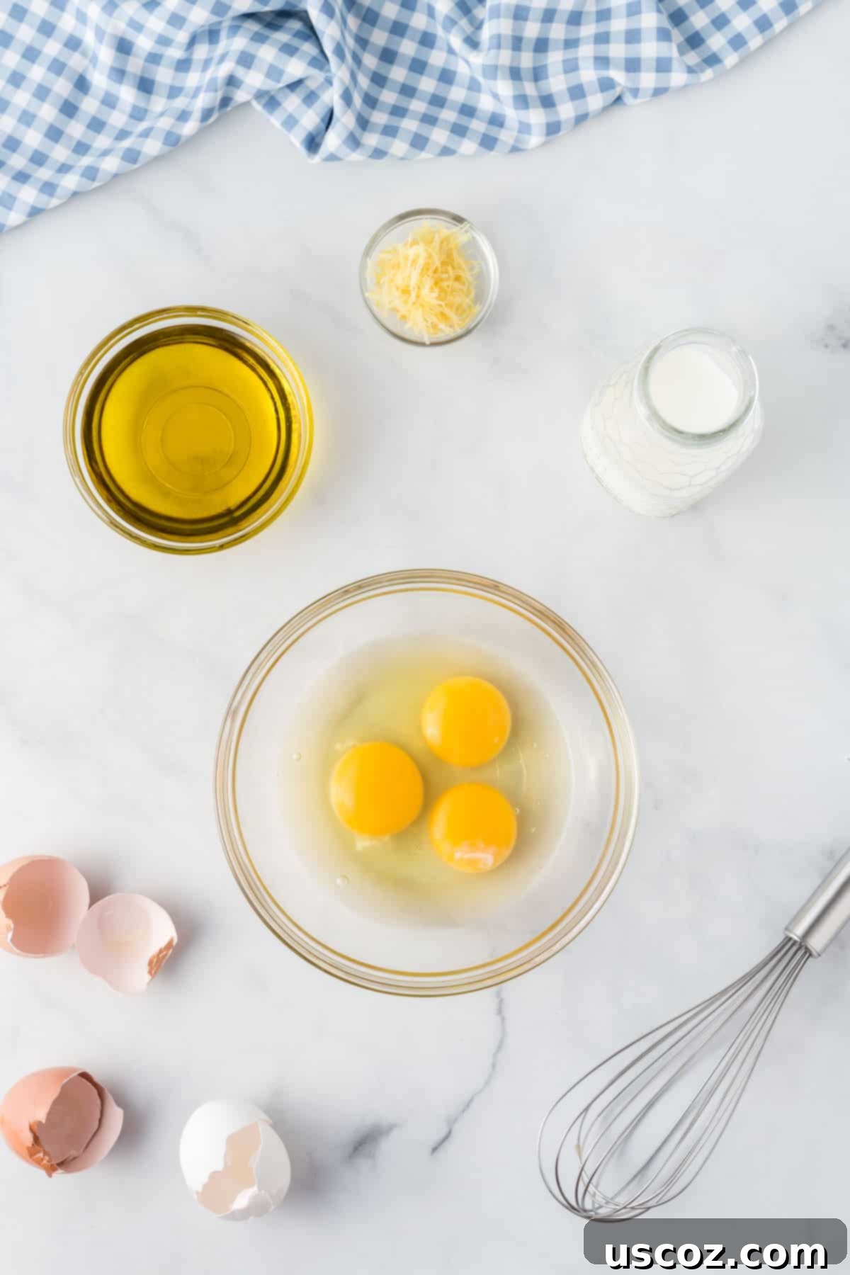 Effortless Cake Mix Blueberry Muffins 4 Separate bowls containing eggs, oil, lemon zest, and milk for muffin preparation