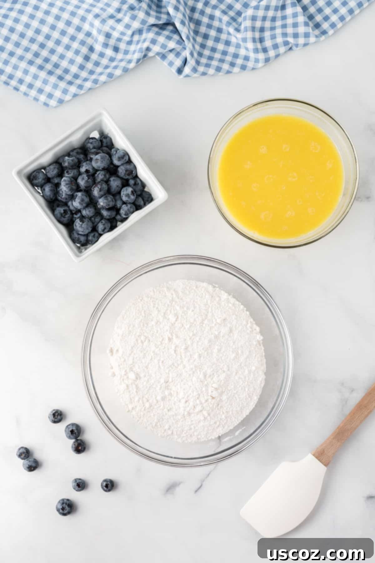 Effortless Cake Mix Blueberry Muffins 7 Cake mix, wet ingredients, and fresh blueberries ready to be combined