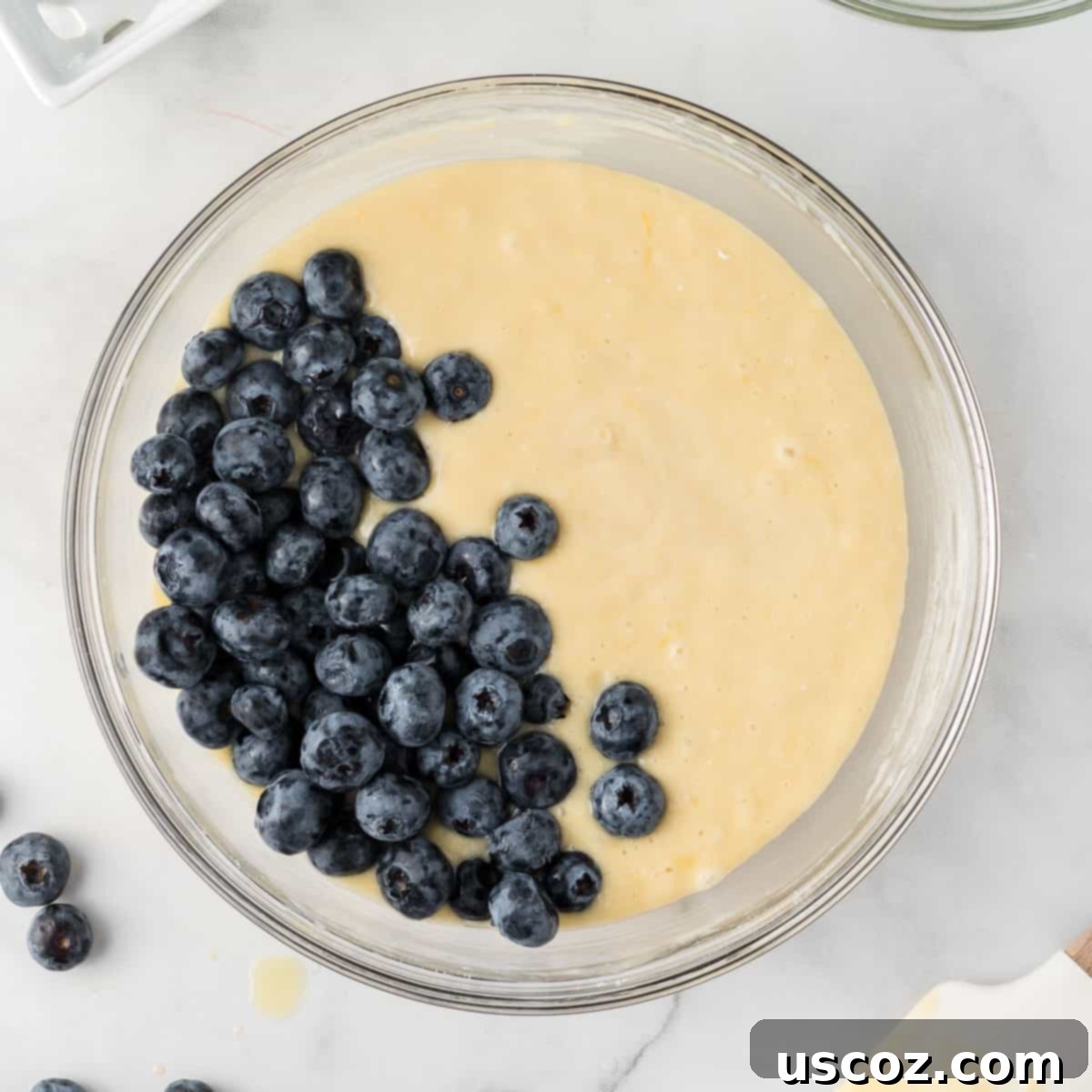 Effortless Cake Mix Blueberry Muffins 9 Folding fresh blueberries into the muffin batter