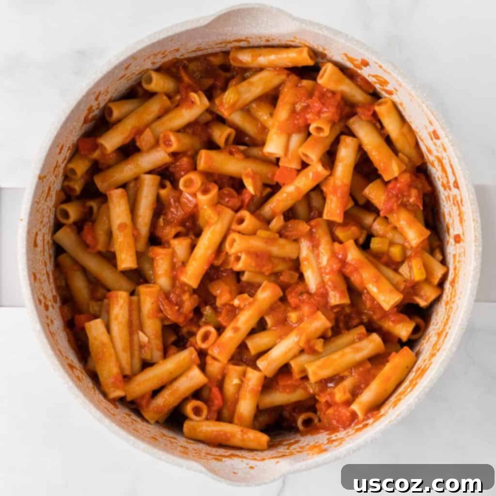 Cheesy Meatless Ziti Bake 12 Ziti noodles mixed thoroughly with the vibrant vegetable sauce
