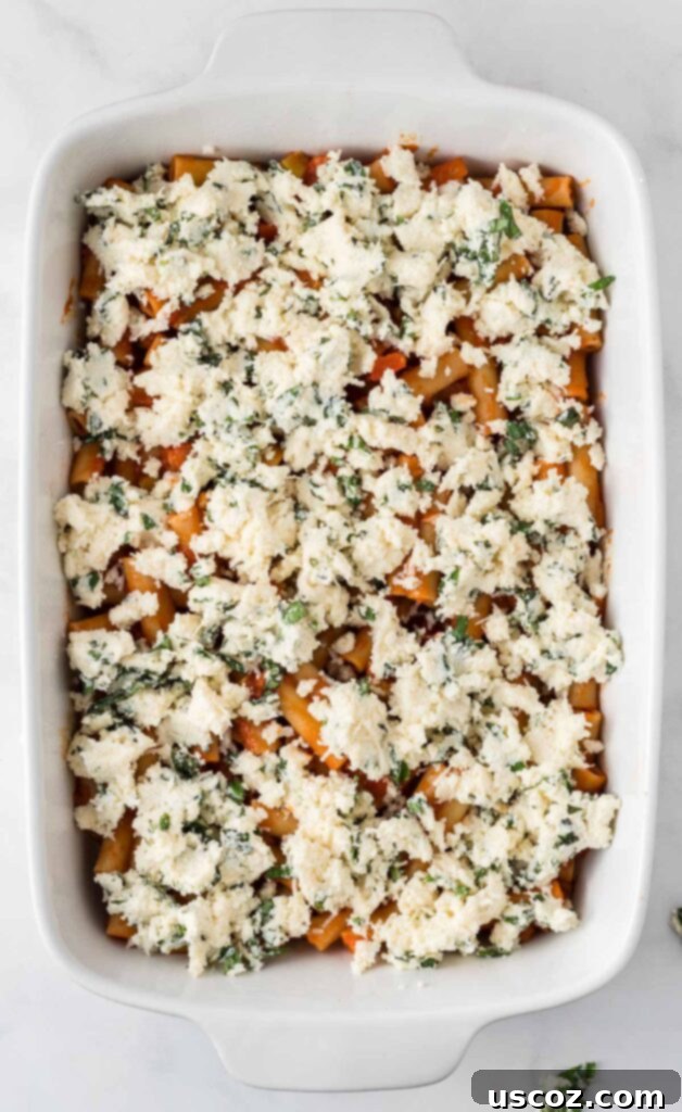 Cheesy Meatless Ziti Bake 14 Spreading the creamy ricotta mixture over the ziti pasta layer