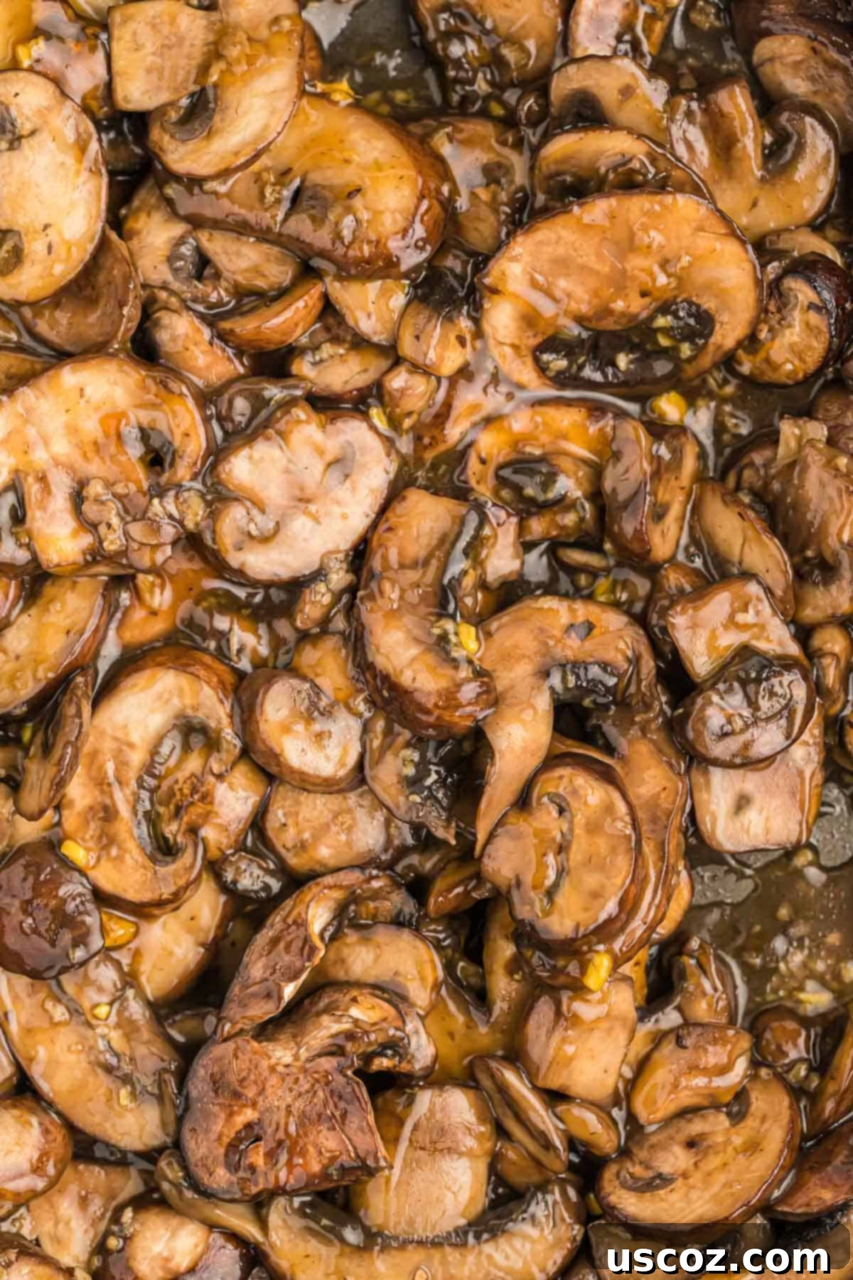 Glazed Teriyaki Mushrooms 8 Close-up of freshly cooked teriyaki mushrooms in a bowl, garnished and ready to be enjoyed.