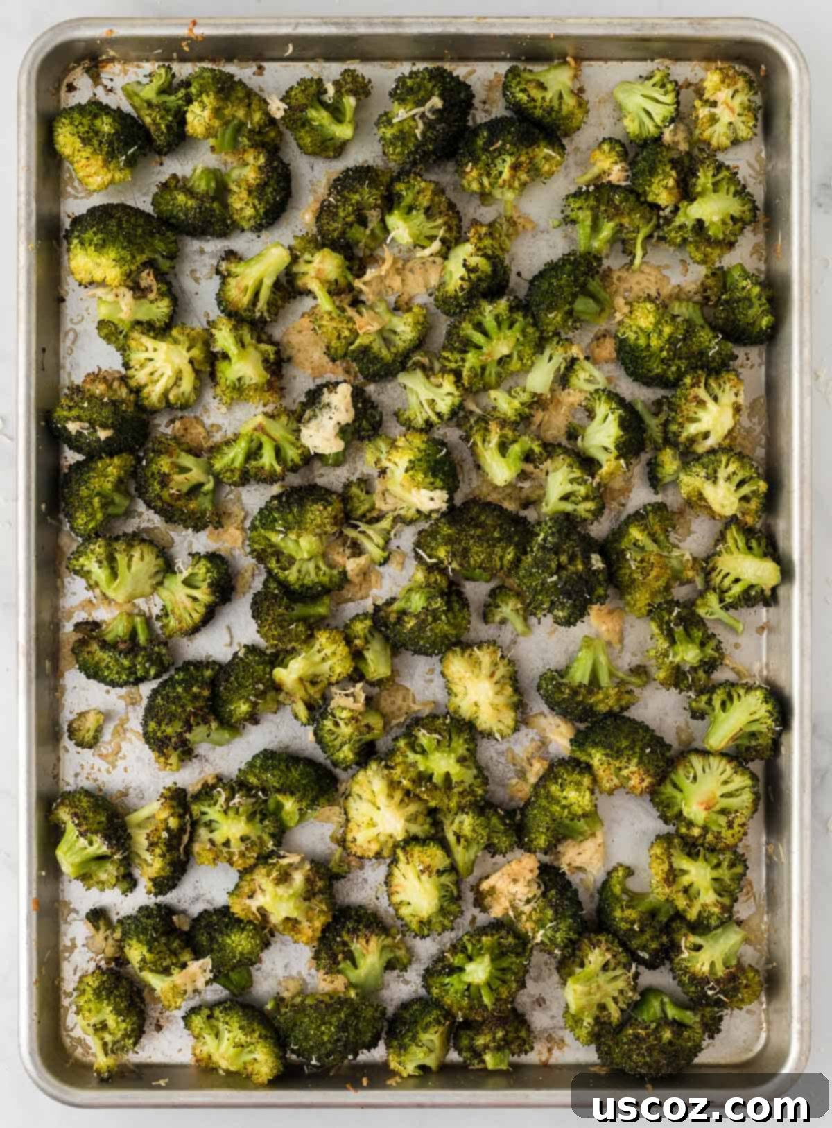 Parmesan Roasted Broccoli 11 Roasted broccoli on a baking sheet, ready to be served