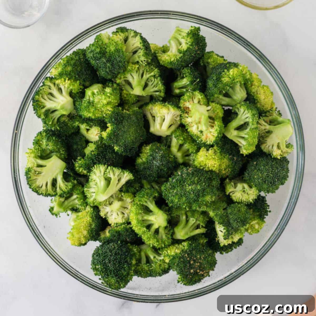 Parmesan Roasted Broccoli 7 Broccoli florets thoroughly mixed with olive oil and spices in a large mixing bowl