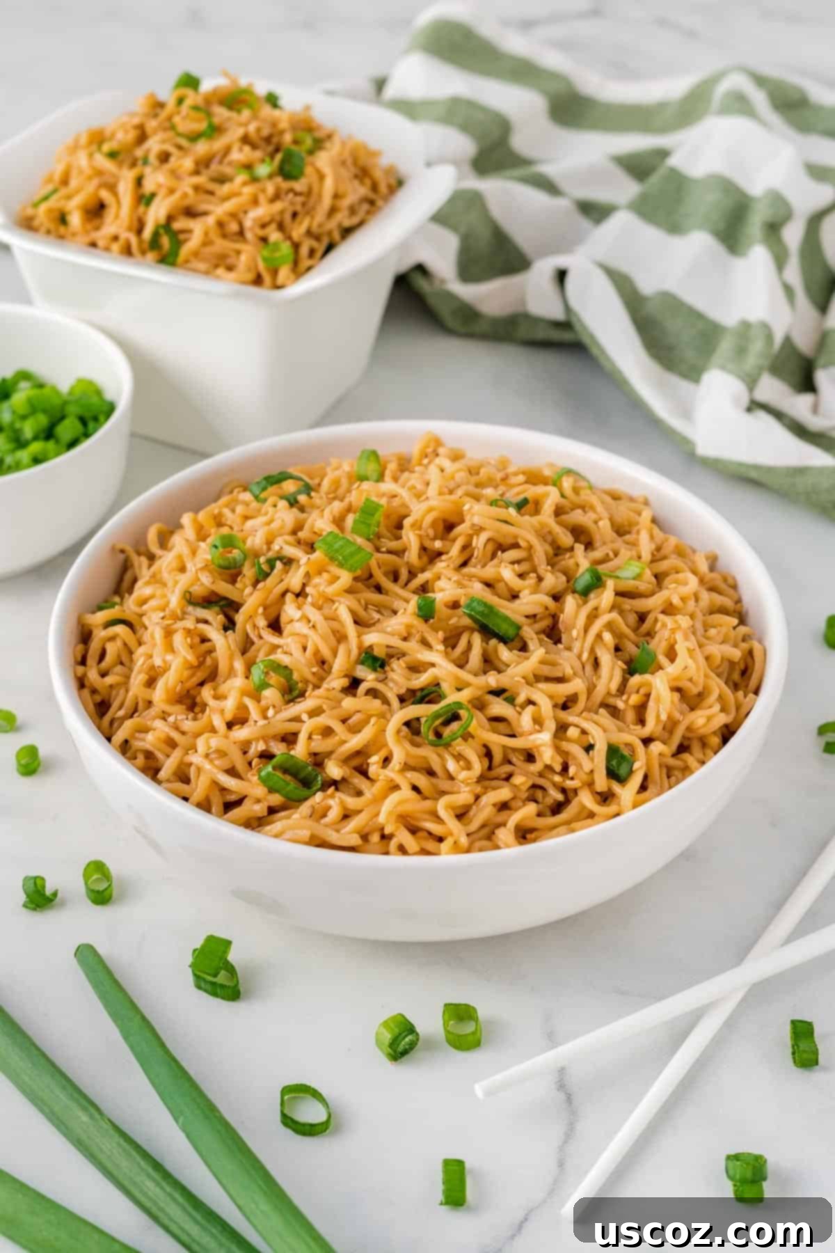 Easy Sesame Garlic Ramen 14 A vibrant bowl of sesame garlic ramen noodles, beautifully garnished with fresh green onions and sesame seeds, resting on a wooden surface.