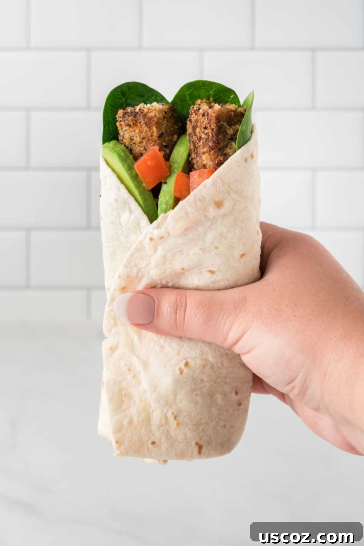 Savory Tofu Wraps 18 hand holding a tofu wrap
