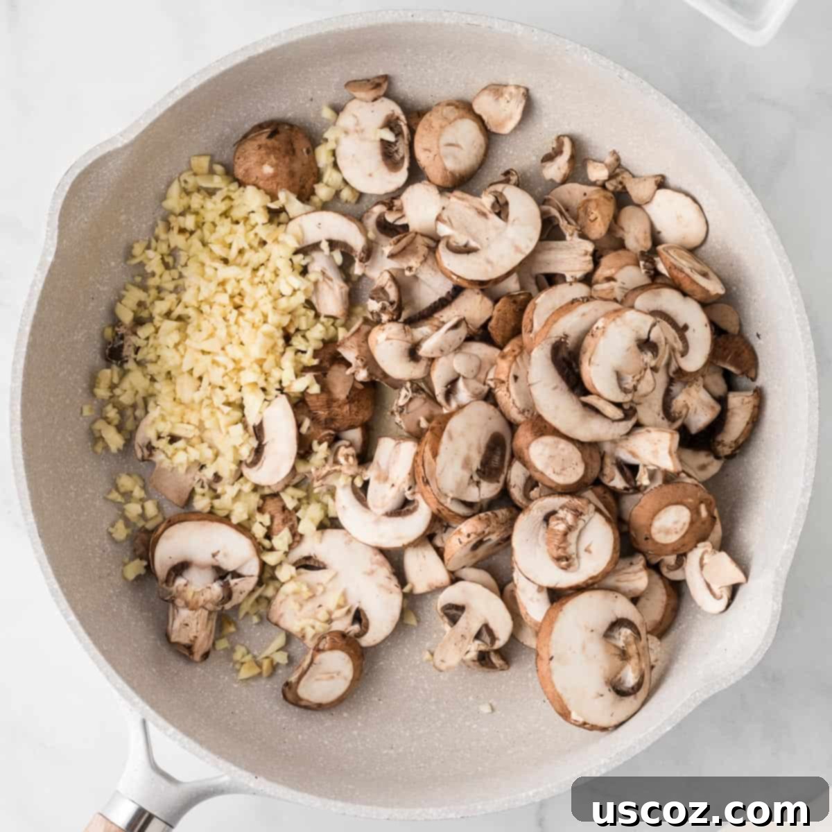 Velvety Mushroom Pasta 5 Sliced baby bella mushrooms and minced garlic sizzling in melted butter in a large skillet, beginning to cook down.