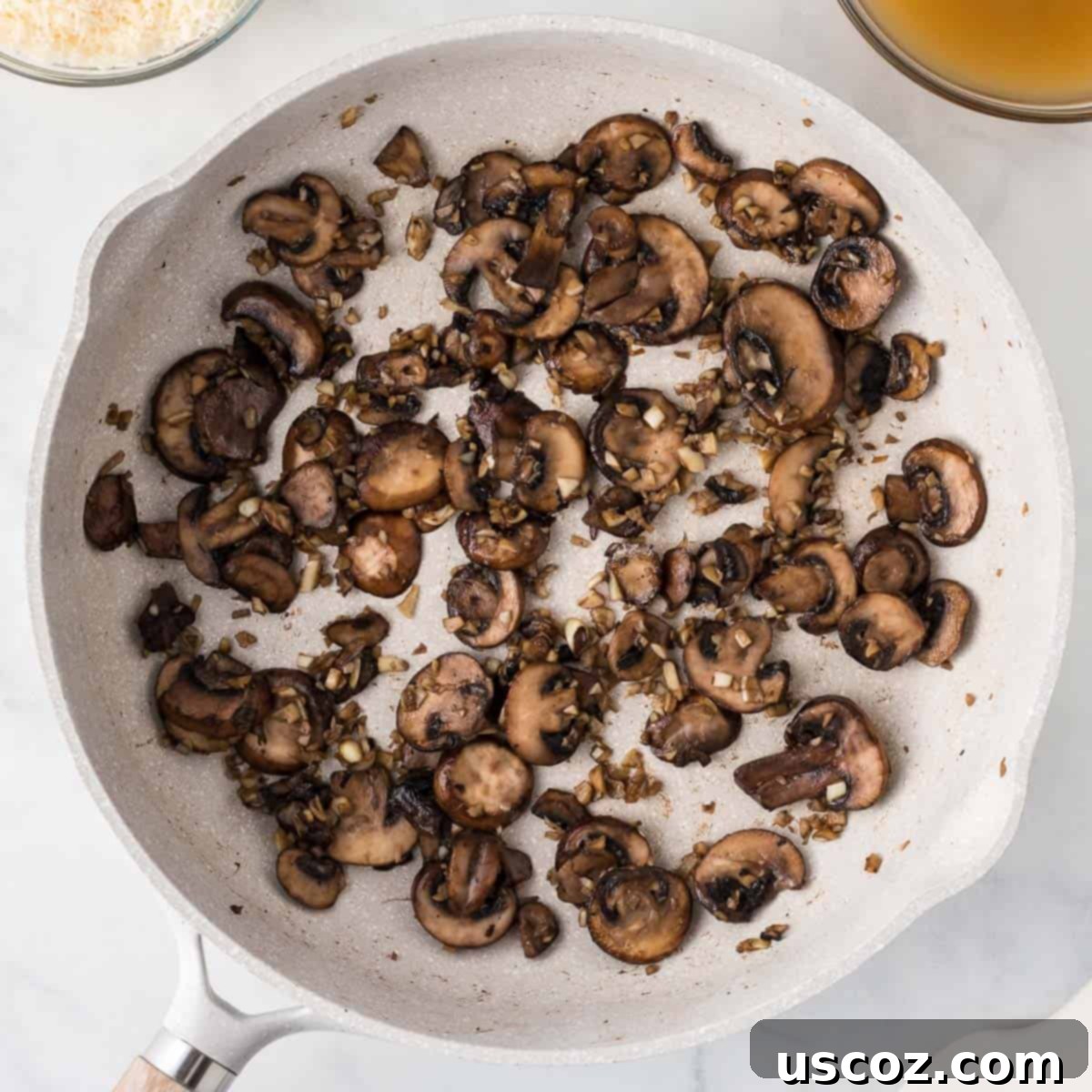 Velvety Mushroom Pasta 6 Cooked-down, browned mushrooms and garlic in a skillet, with all liquid evaporated, ready for the cream sauce.