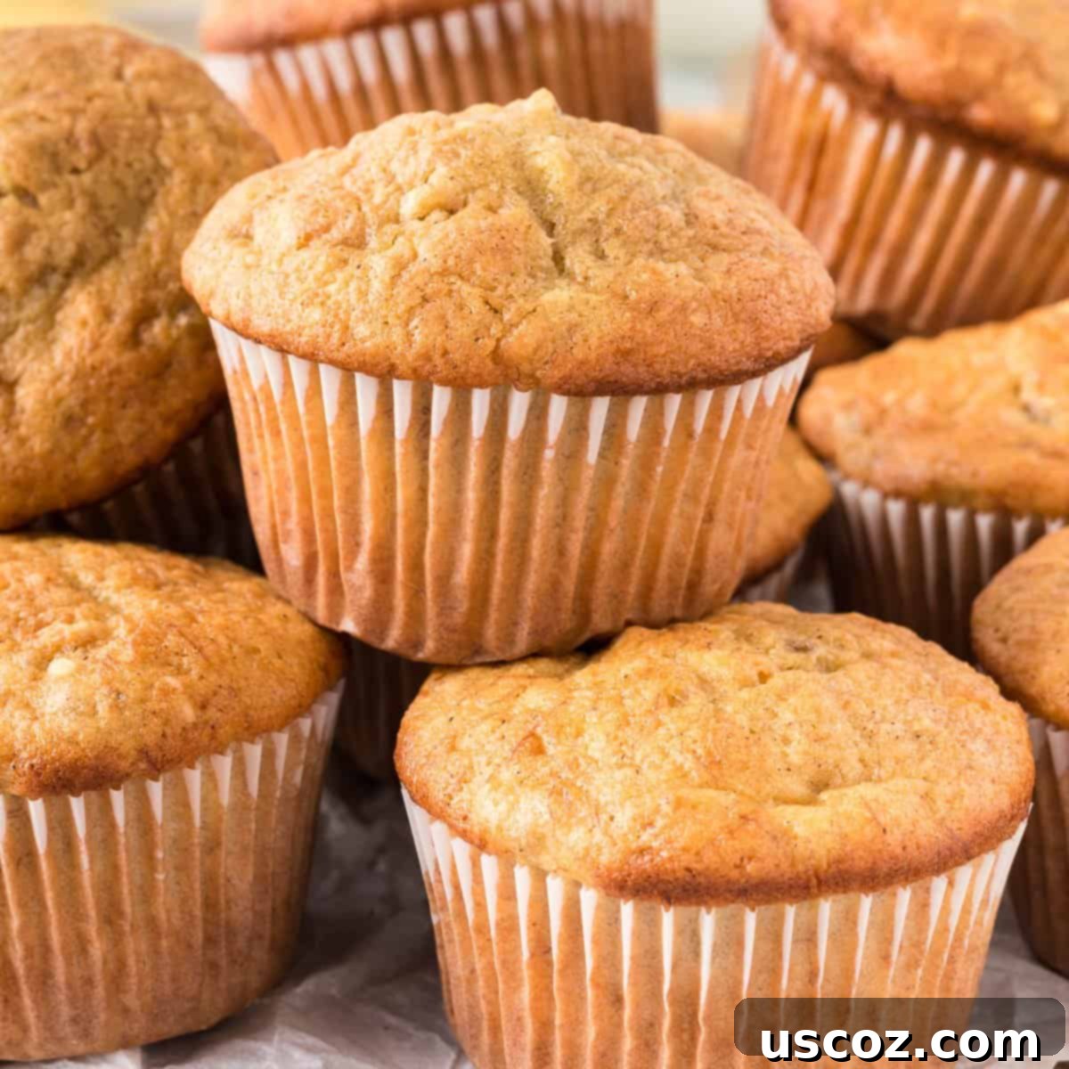 Easy Cake Mix Banana Muffins 15 Stacked homemade cake mix banana muffins, perfectly golden and fluffy, a testament to quick and easy baking.