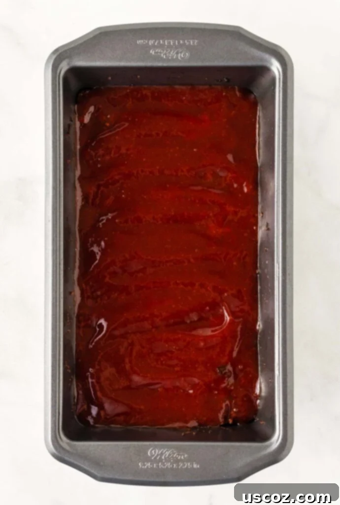 Hearty Plant-Based Meatloaf 14 Vegetarian meatloaf in a loaf pan topped generously with the sweet and tangy ketchup glaze before its final bake