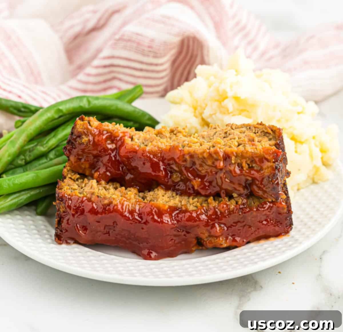 Hearty Plant-Based Meatloaf 18 A complete plate of vegetarian meatloaf with green beans and mashed potatoes, ready to be enjoyed as a hearty meal