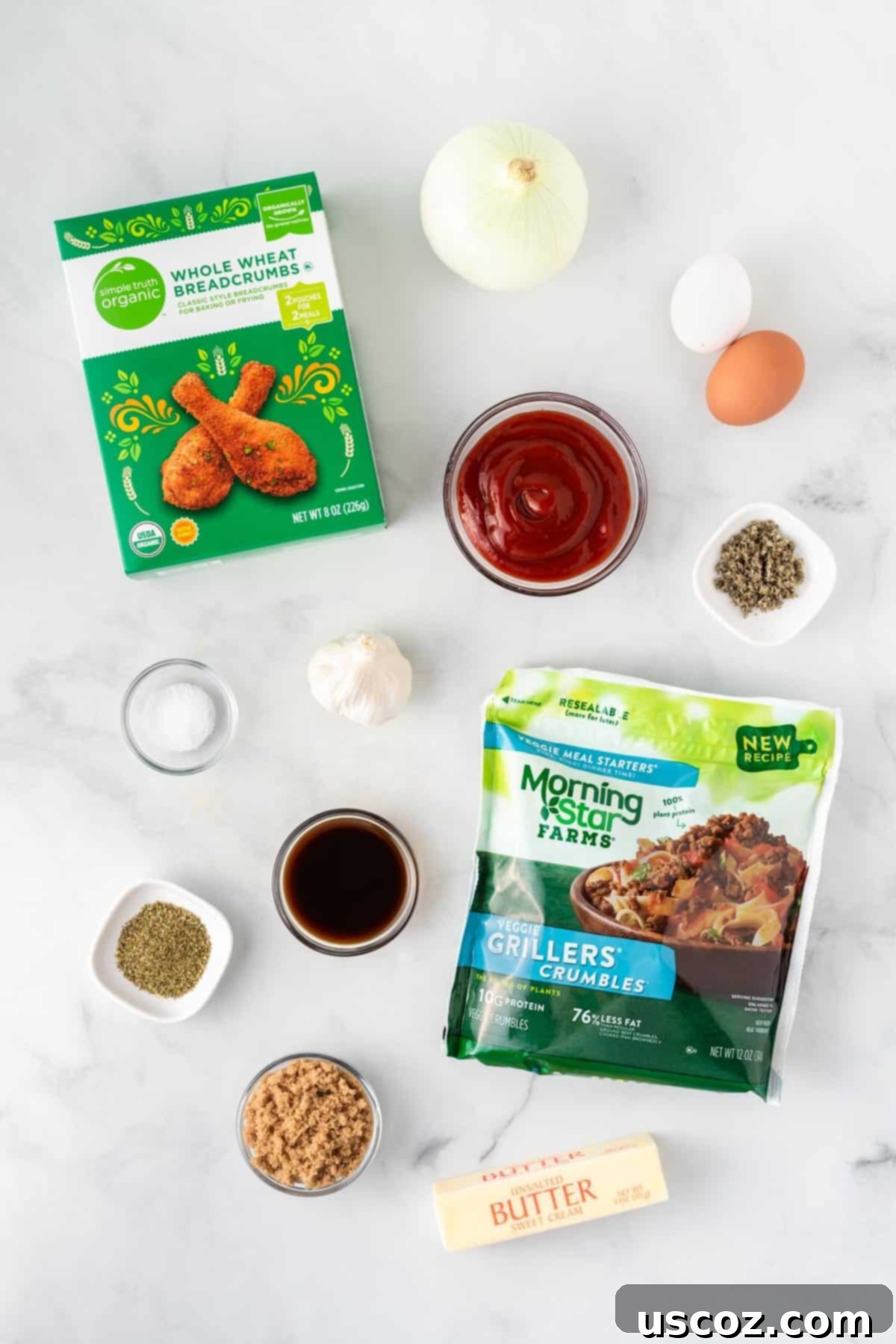 Hearty Plant-Based Meatloaf 5 A flat lay of all fresh and dry ingredients needed to make a delicious vegetarian meatloaf, including crumbles, eggs, spices, vegetables, and glaze components