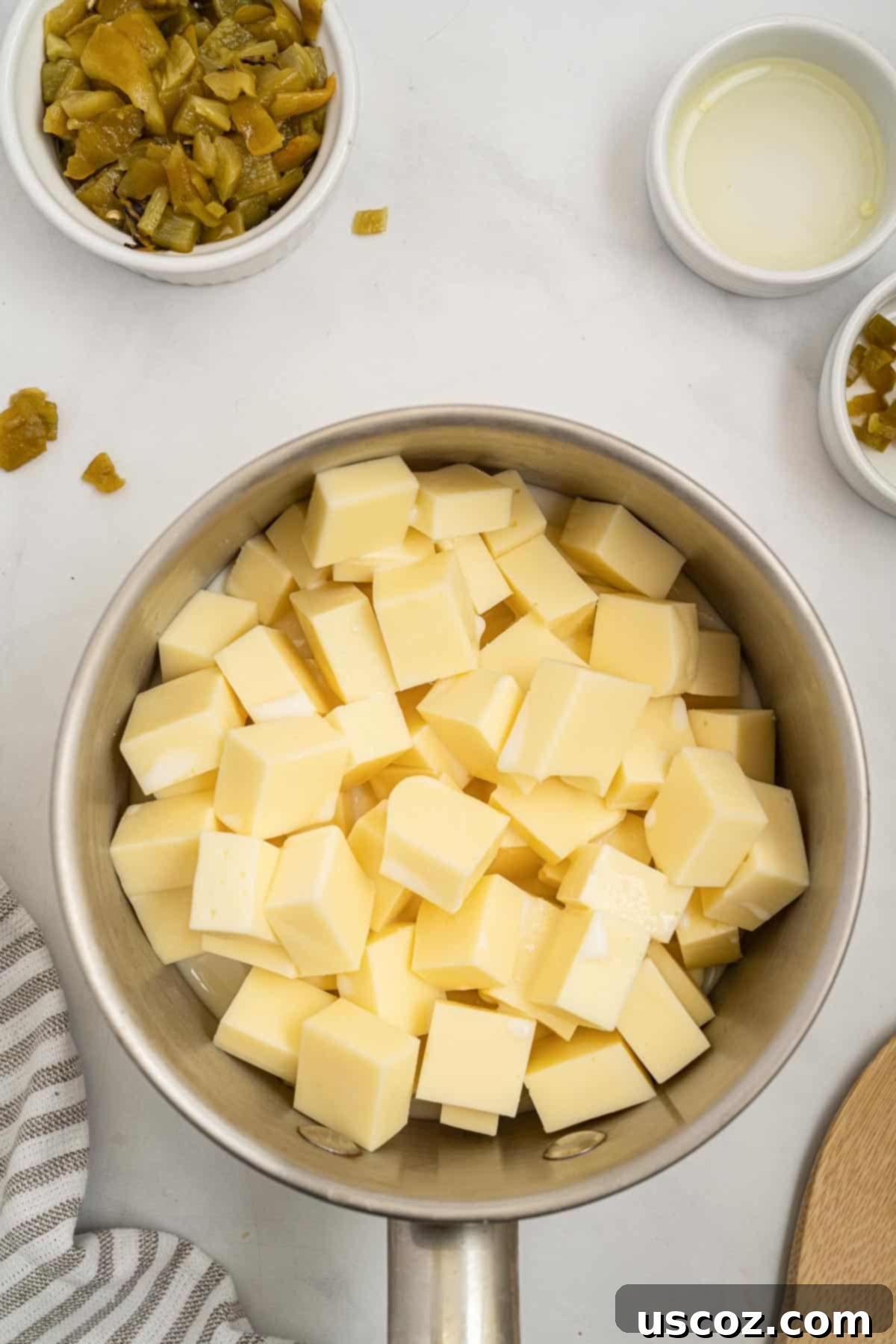 Simple Fresh White Cheese 4 american cheese chunks in a sauce pan