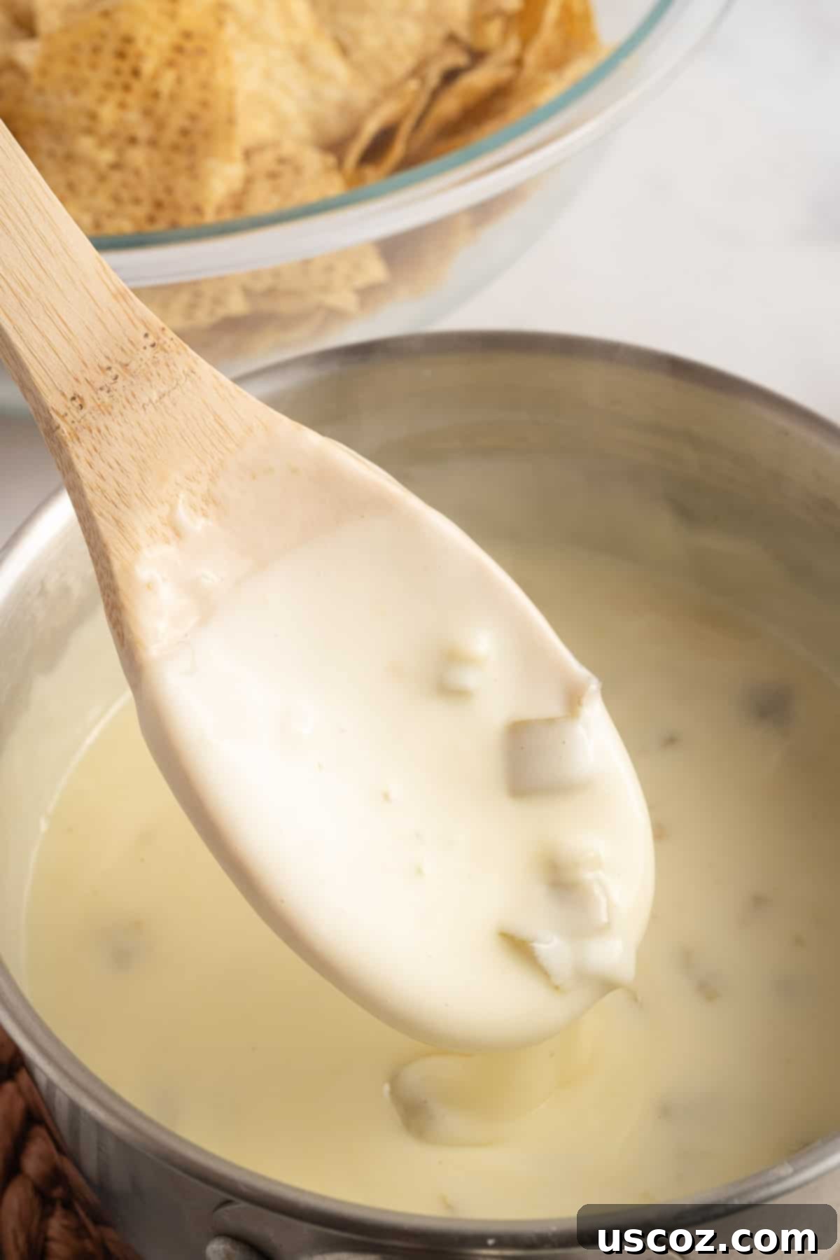 Simple Fresh White Cheese 6 wooden spoon stirring queso blanco