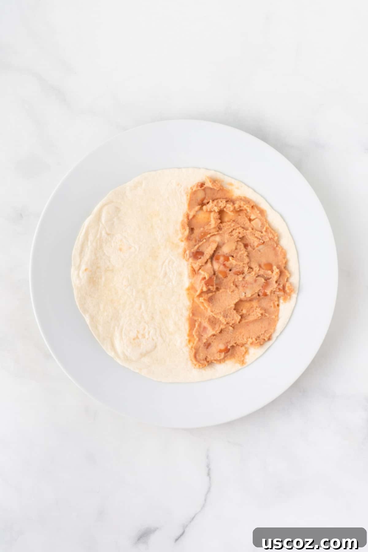 Air Fryer Quesadilla Perfection 4 soft taco shell half spread with refried beans