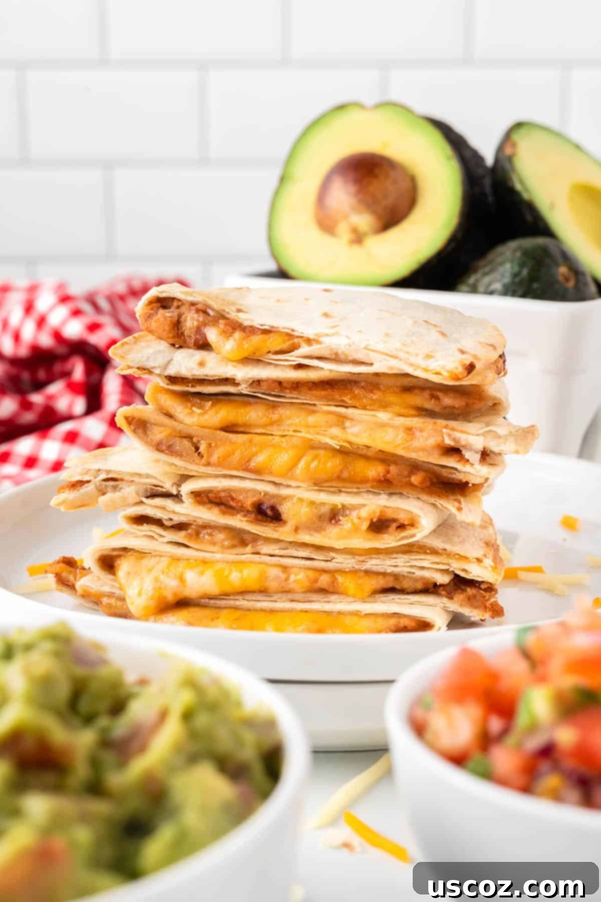 Air Fryer Quesadilla Perfection 10 air fryer quesadillas stacked on a plate