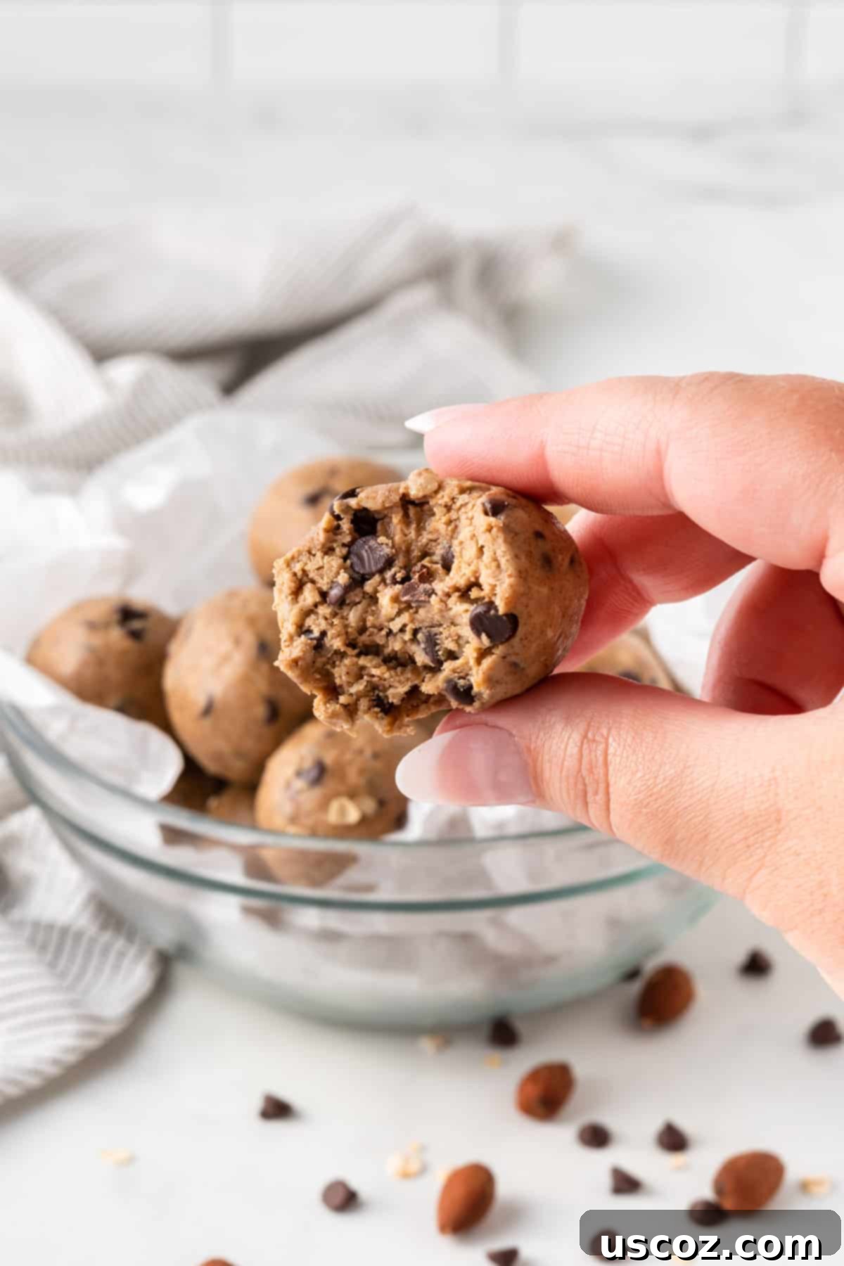 Almond Butter Power Bites 10 energy ball with a bite taken out to show the soft, chewy texture inside