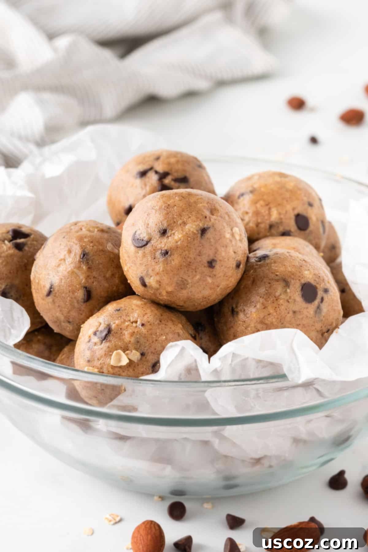 Almond Butter Power Bites 11 almond butter protein balls stacked in a bowl with a fork