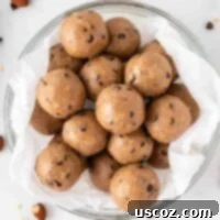 Almond Butter Power Bites 13 almond butter protein balls stacked in a bowl