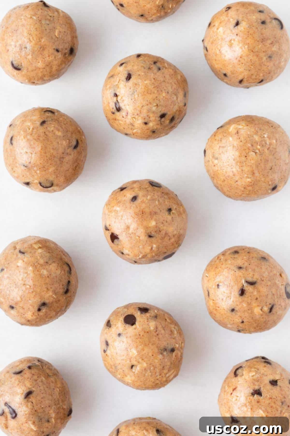 Almond Butter Power Bites 9 almond butter energy balls on a baking sheet, ready for storage