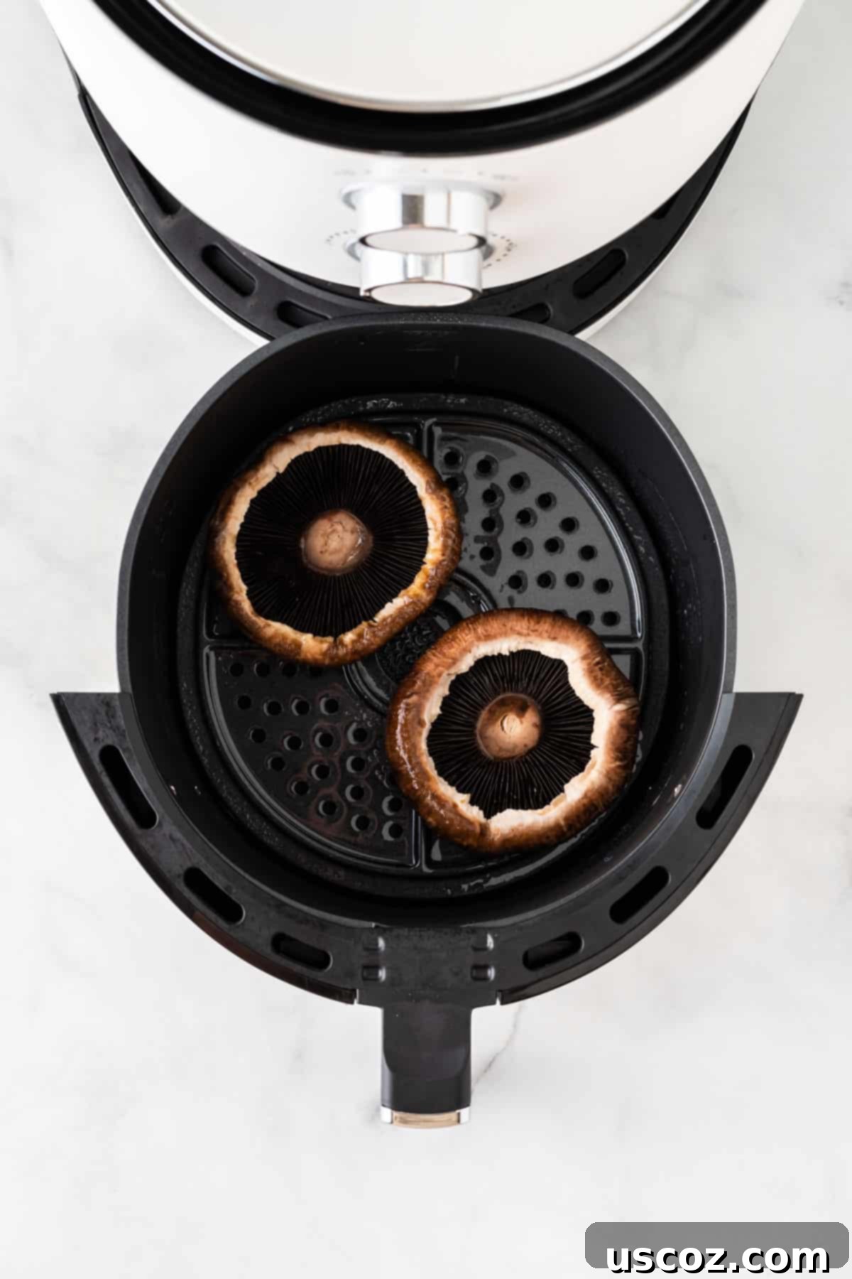 Crispy Air Fryer Portobello Mushrooms 6 adding the portobello mushrooms to the air fryer