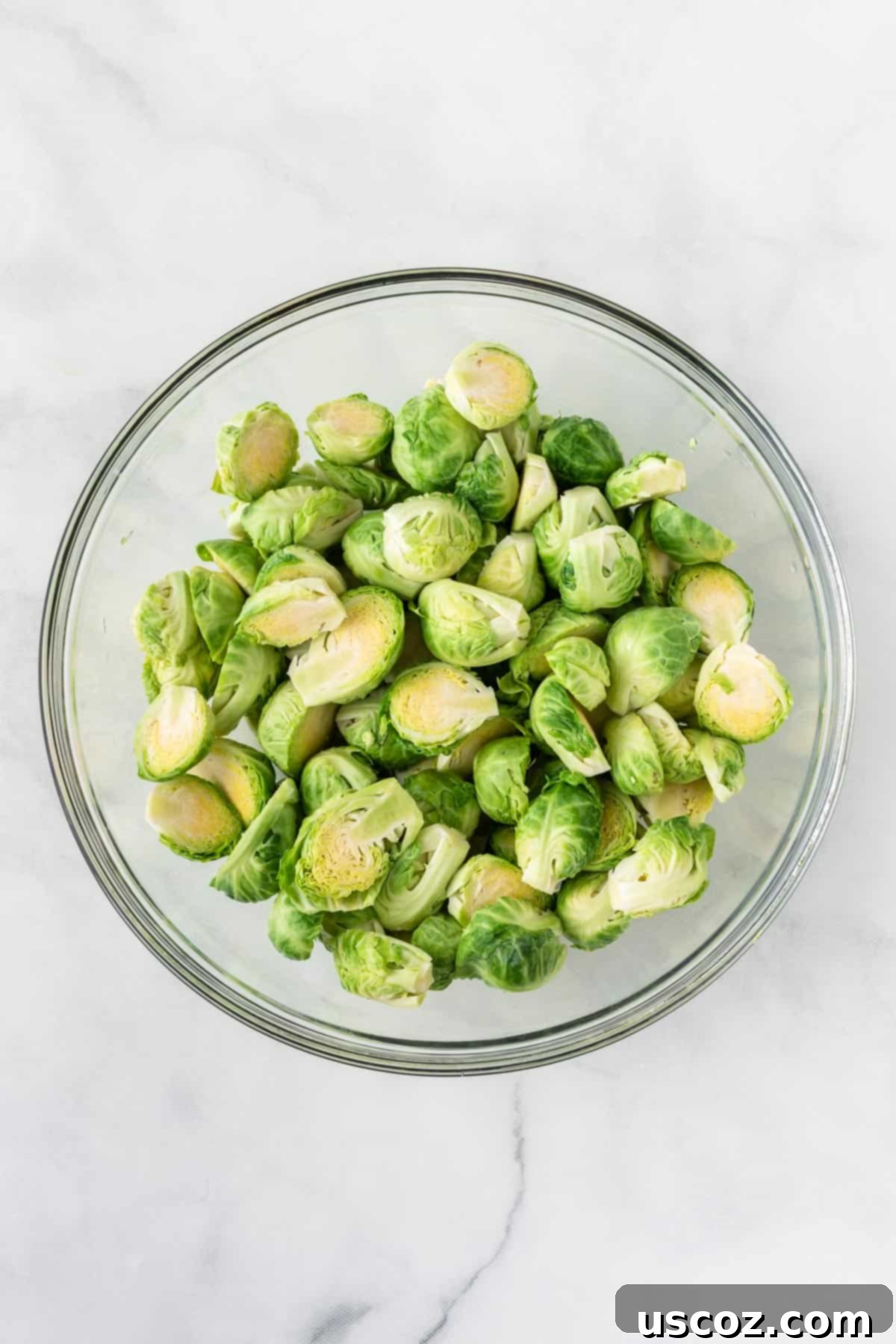 Crispy Air Fryer Brussels Sprouts 5 halved brussels sprouts in a glass bowl