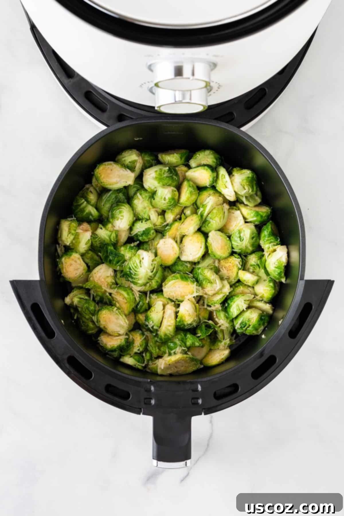 Crispy Air Fryer Brussels Sprouts 7 placing the brussels into the air fryer basket