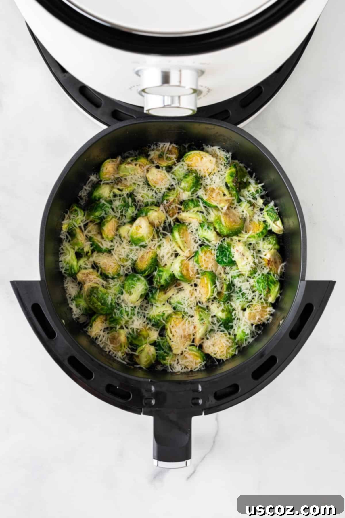 Crispy Air Fryer Brussels Sprouts 9 adding cheese to the brussels