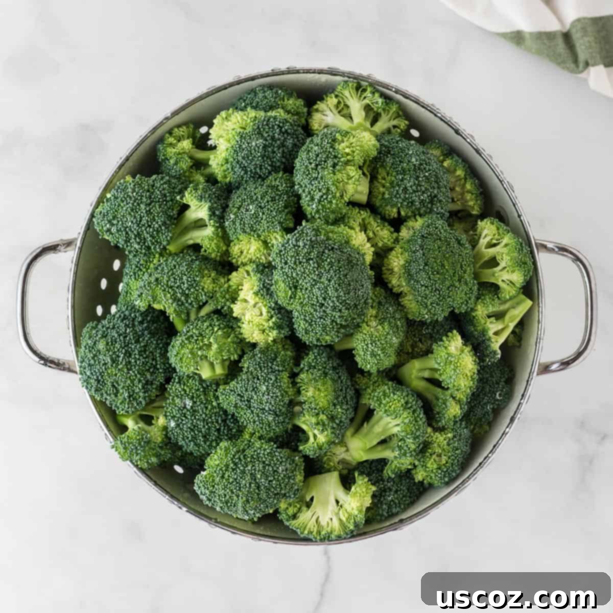 Foolproof Instant Pot Broccoli 3 broccoli florets in a strainer