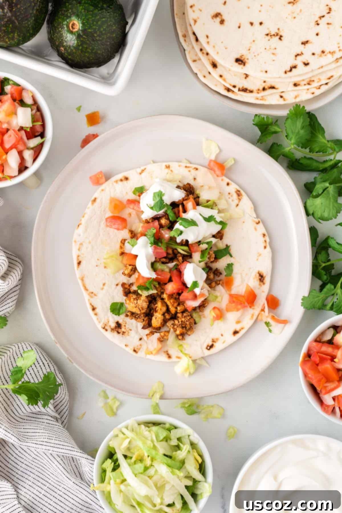 Zesty Tofu Tacos 9 tofu taco topped with sour cream, cilantro, and tomatoes
