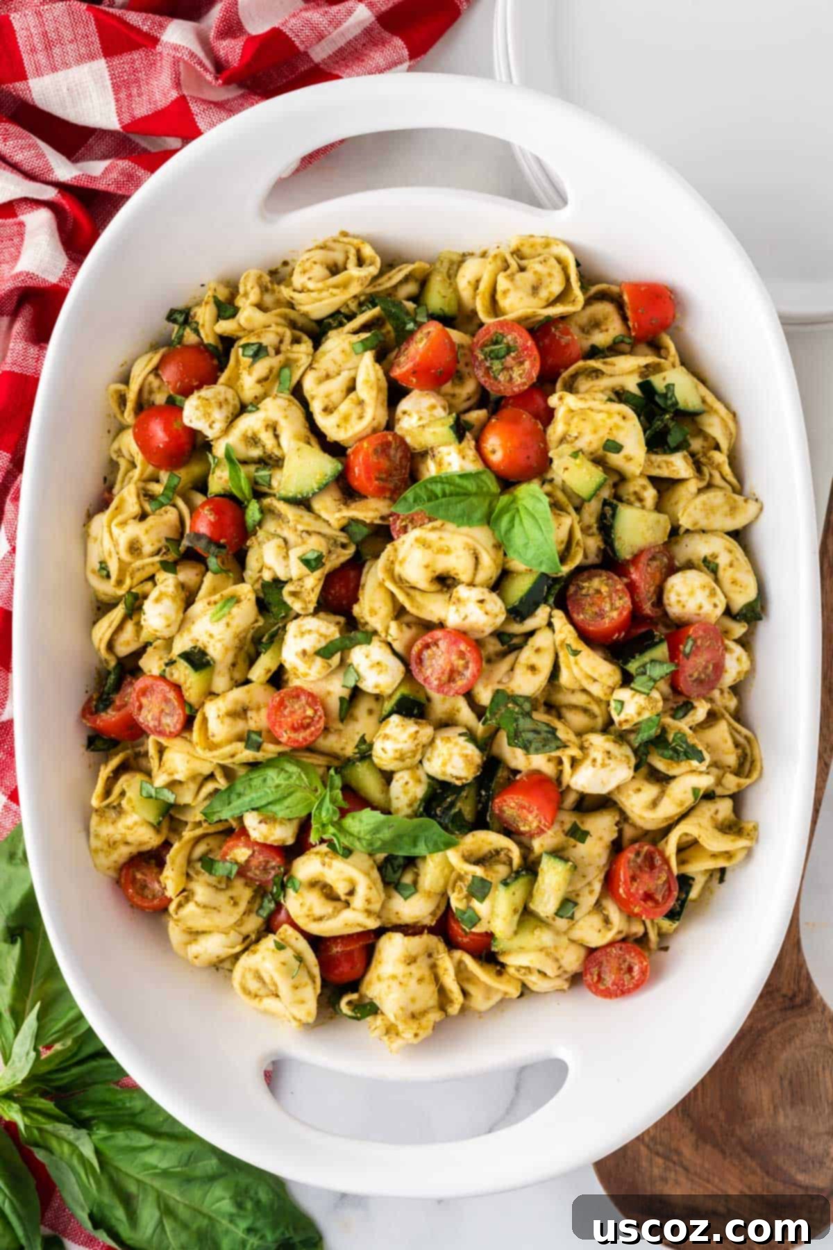 Zesty Tortellini Medley 8 tortellini pasta salad in a white serving dish, ready to be served