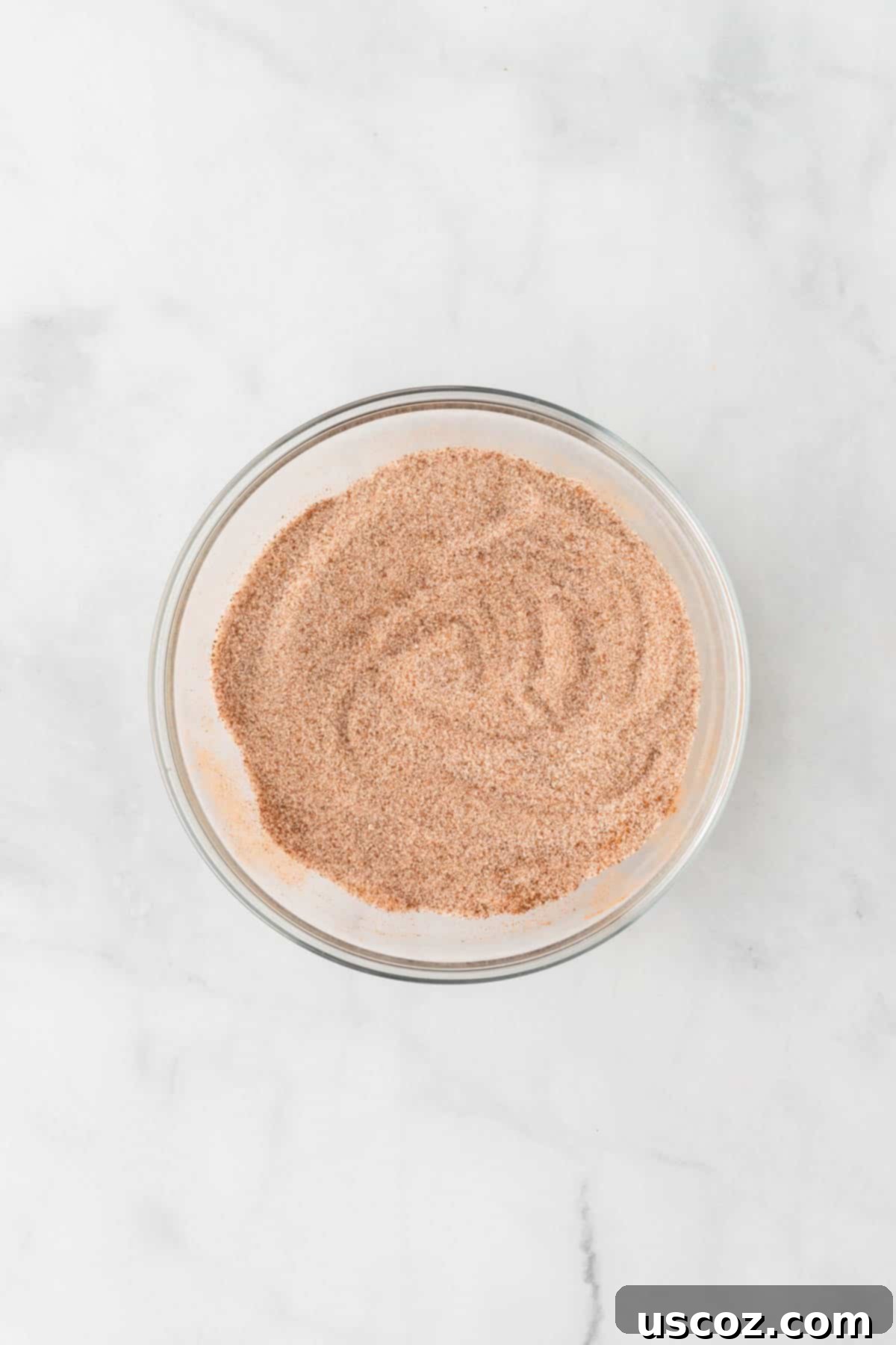 Effortless Cake Mix Snickerdoodles 9 A small bowl of cinnamon sugar mixture, ready for rolling the cookie dough