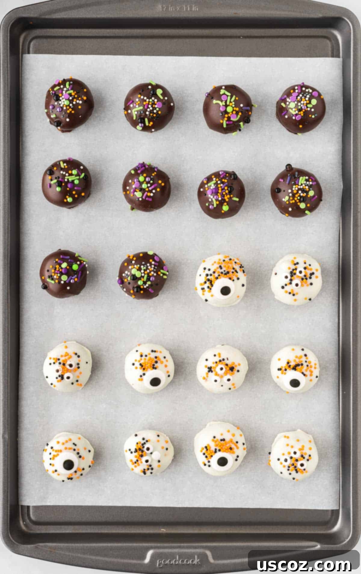 Spooky Oreo Truffles 16 Finished Halloween Oreo balls with dark and white chocolate coatings and sprinkles on a baking sheet
